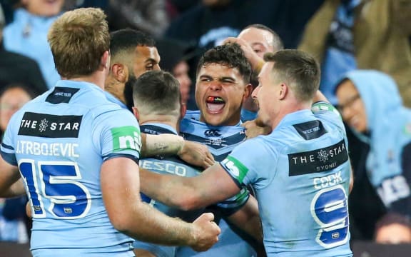 The NSW Blues celebrate the Latrell Mitchell try.