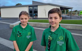Year Six students Hazel Bourne and Oscar Black are looking forward to a warm school at the new site.