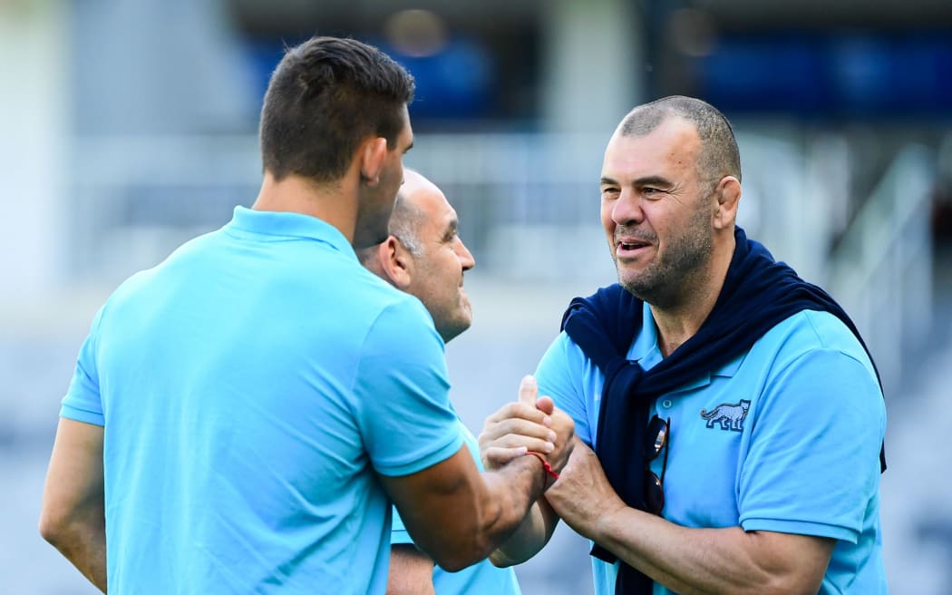 Argentina captain Pablo Matera, coach Mario Matera and coaching consultant Michael Cheika.