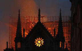 Flames and smoke rise from Notre-Dame de Paris Cathedral.
