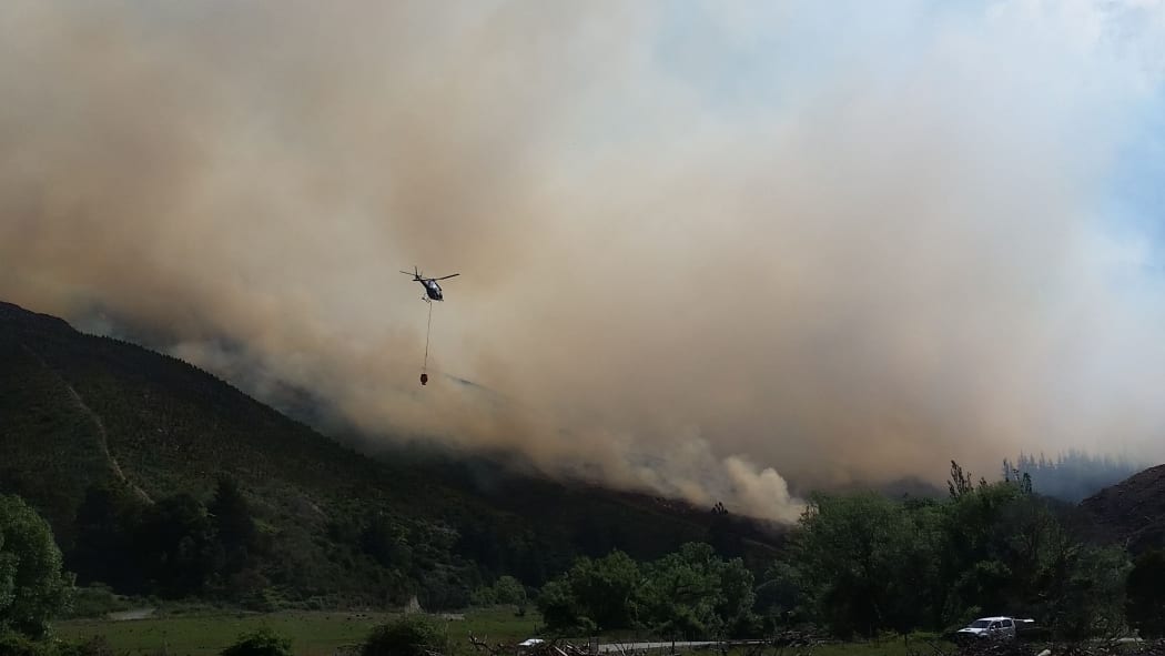 Nine helicopters fought the forest fire in the Waikakaho Valley by air last week.
