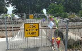 Memorial tributes at the rail crossing where Matthew Meijer died.