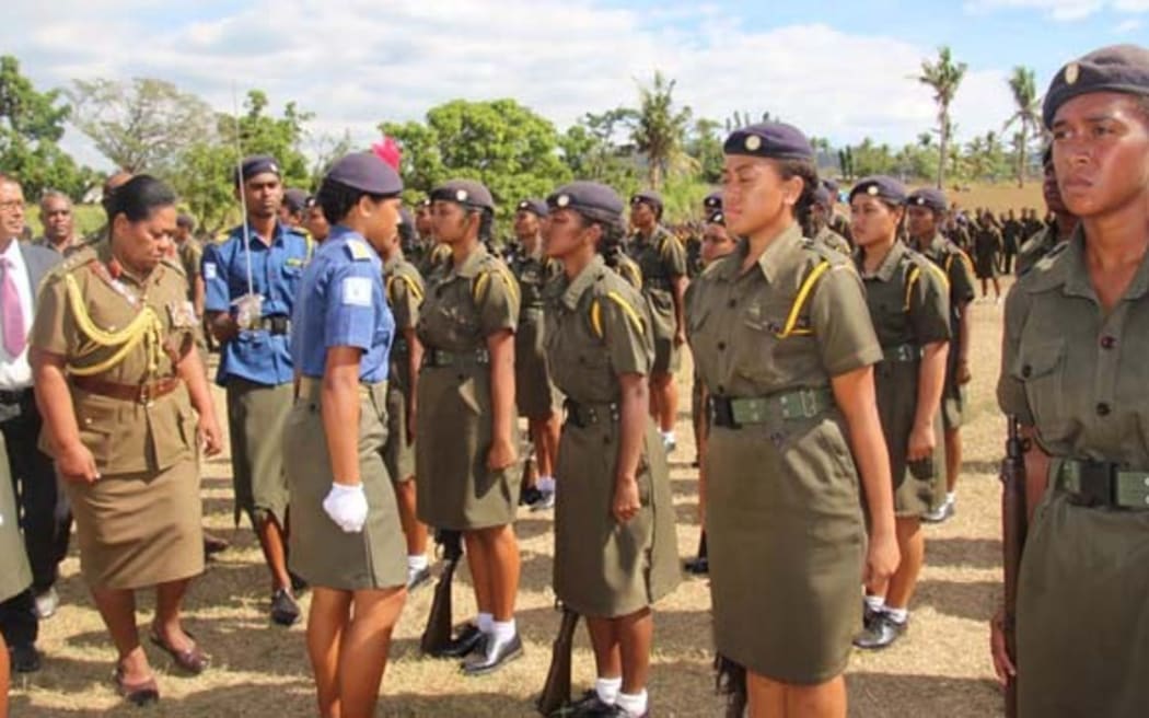 Colonel Litea Seruiratu (fourth from left) reviews detachment of female cadets at Xavier College in Ba.