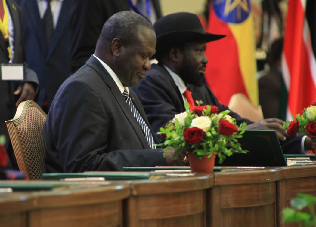 President of South Sudan Salva Kiir Mayardit (R) and opposition leader of South Sudan Riek Machar (L) attend a signing ceremony of agreement between South Sudanese government and armed oppositions on sharing power and security regulations in Khartoum, Sudan on August 05, 2018.