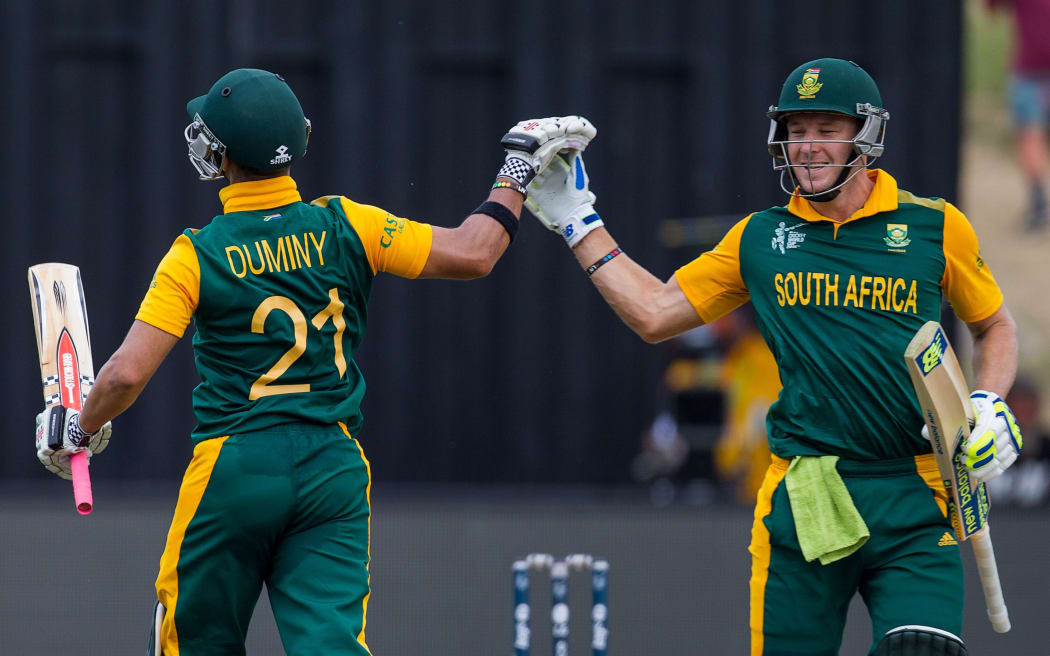 South Africa's David Miller and JP Duminy celebrates his hundred during the ICC Cricket World Cup match - South Africa v Zimbabwe at Seddon Park, Hamilton, 15 February 2015.