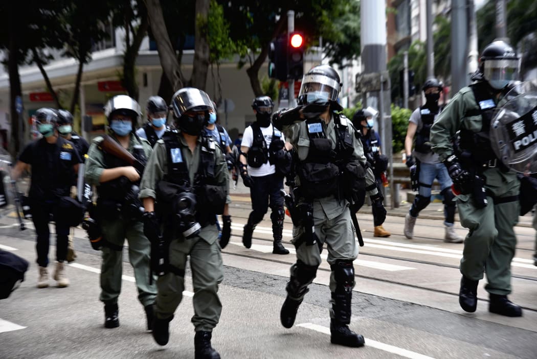 Police officers control the demonstration in Hong Kong Island on July 1, 2020, on the 23rd anniversary of the former British colony's handover to China.