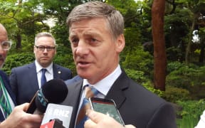 NZ Prime Minister Bill English speaks to reporters in Japan.