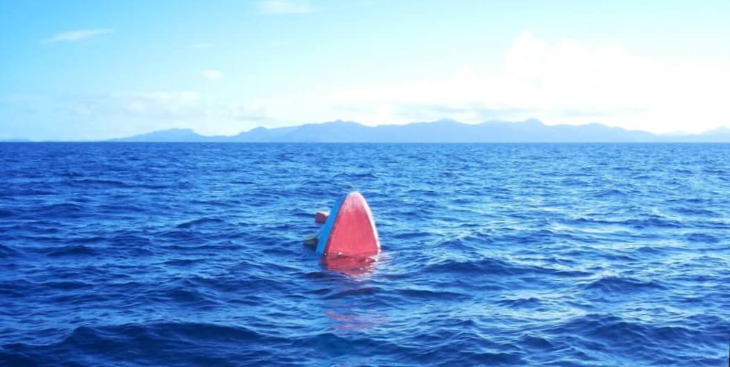 The tip of a submerged boat that sank near Bungana in Solomon Islands on 25 June 2019. 20 people were rescued by the 26th but two men are still missing.