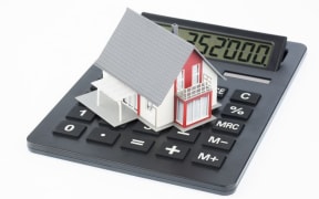 House on calculator (stock)