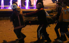 Police carry away one of the injured after a deadly explosion in the Turkish capital on 14 March 2016 (NZT).