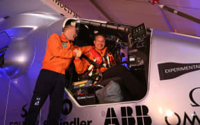 Bertrand Piccard (left) and Andre Borschberg before taking off in the Solar Impulse 2 from Abu Dhabi .