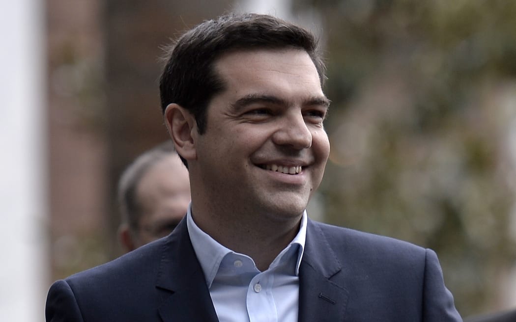 Alexis Tsipras leaves the presidential palace after being sworn in as Greece's new Prime Minister.