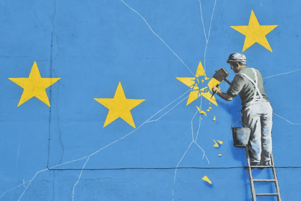 A mural by British artist Banksy depicting a workman chipping away at one of the stars on a European Union  themed flag. Dover, England, 7 January 2019.