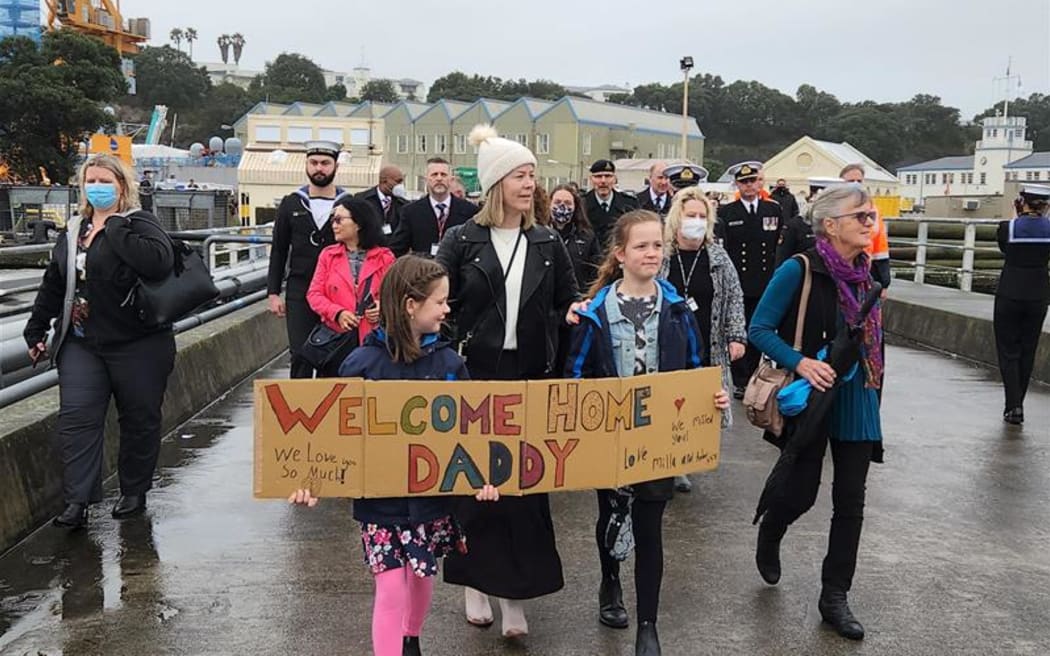 The family of Commander Officer Mike Peebles waiting for his return.