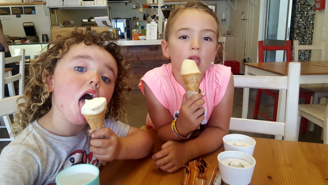 Four-year-old Mac Stephens of Nelson (left) and Tazmin Emsley, 6, also of Nelson, cool off with gelato in a Nelson café.