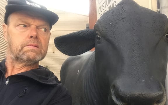 Bruce goes eye to eye with a replica bull in the town of Bulls.