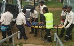 A suicidal refugee is taken to hospital from one of the detention centres on Manus Island.