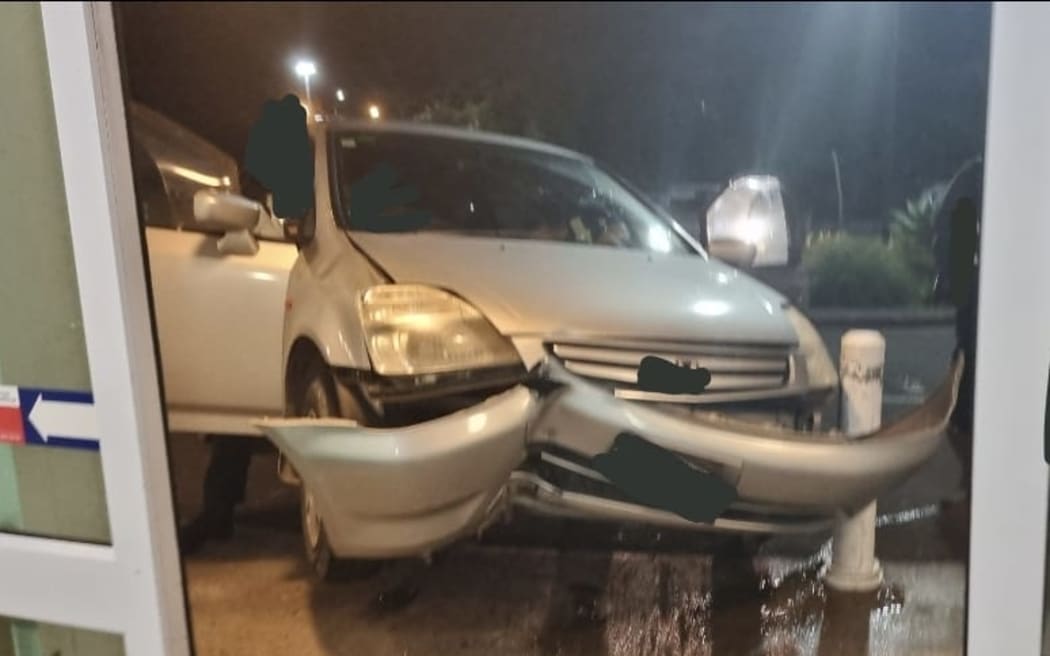 The wreckage of a car driven towards a packed North Shore Hospital Emergency Department waiting room on Saturday night. The vehicle crashing on to bollards outside the waiting room doors.