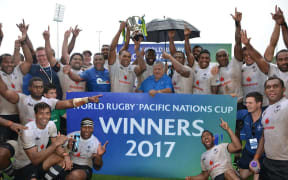 Fiji celebrate winning their third straight Pacific Nations Cup title.