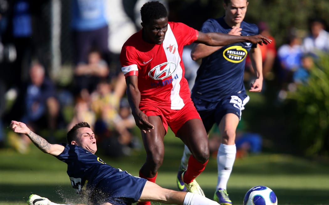 Sanni Issa playing for Amicale FC against Auckland City during the 2014 Oceania Champions League final. Issa joined Auckland in the off-season.