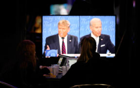 People watch the first presidential debate between US President Donald Trump and former US Vice President Joe Biden.