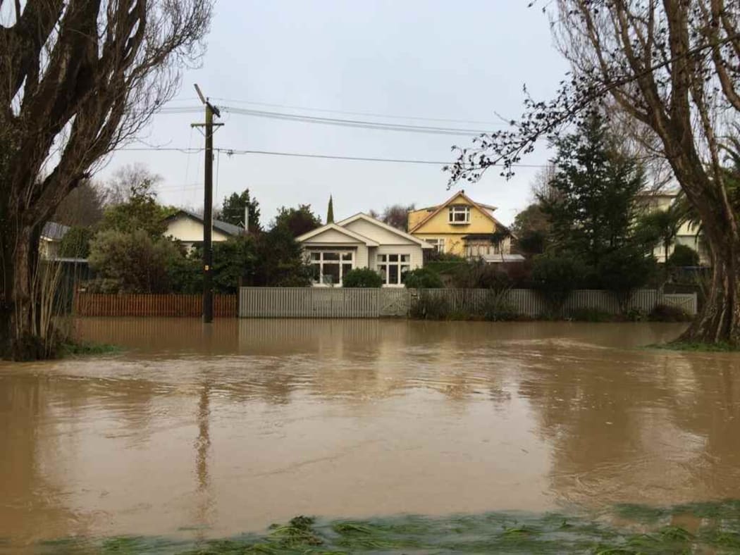 Eastern Terrace in Christchurch, where the water is high but receding, on Sunday morning.
