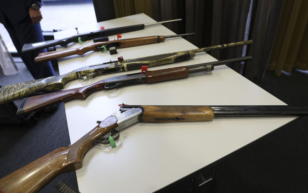 Firearms that will remain legal, depending on number of rounds and magazine type, on display at the police press conference.