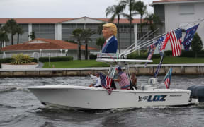 FORT LAUDERDALE, FLORIDA - OCTOBER 03: Boaters show their support for President Donald Trump during a parade down the Intracoastal Waterway on October 3, 2020 in Fort Lauderdale, Florida.