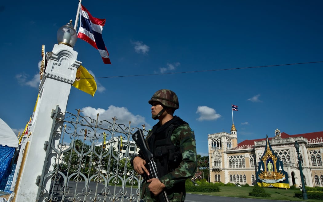 A soldier stands guard at Government House, where the anti-government protesters had set up their main camp in Bangkok.