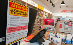 A sign in a pharmacy about coronavirus
