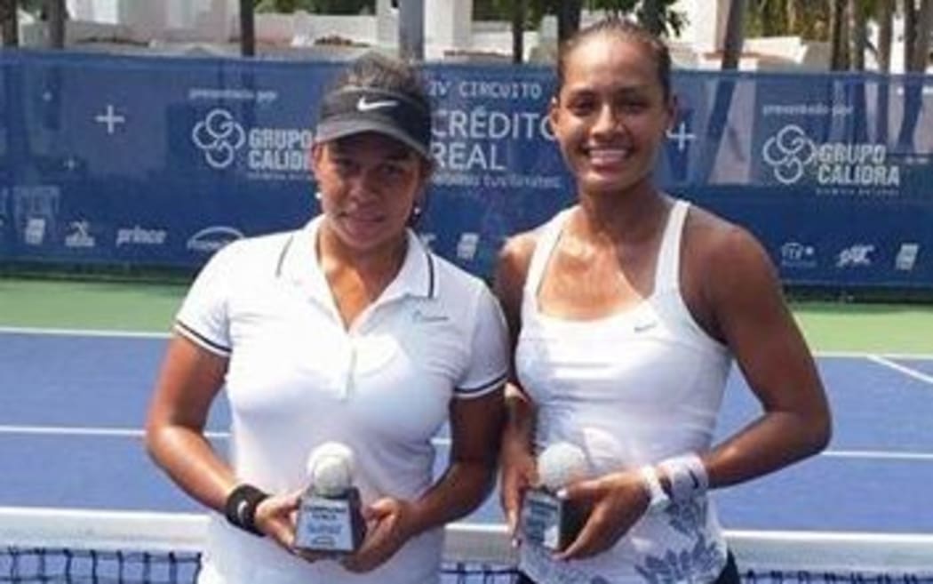 Steffi Carruthers (R) and Carolina Betancourt celebrate their doubles win in Mexico.