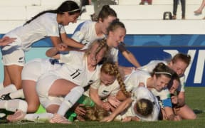 New Zealand players celebrate after defeating Japan in a penatly shoot-out during their FIFA U-17 Women's World Cup Uruguay 2018 quarter-final football match.