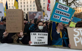 Ukrainian people and their supporters demonstrate outside Downing Street calling for the West to implement strong sanctions against Russia.