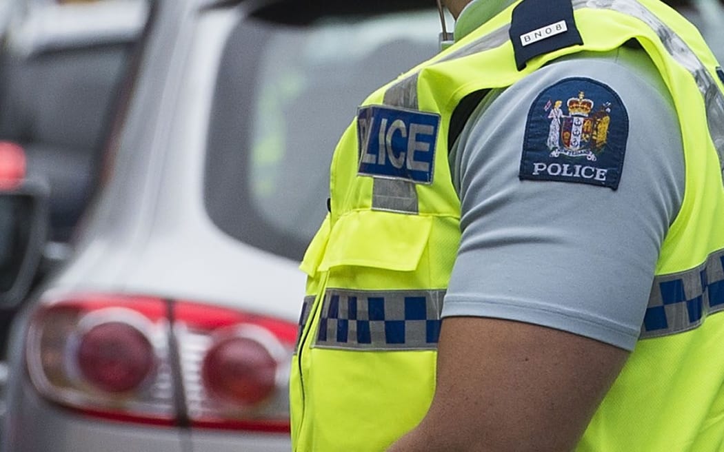 Officer wearing police vest in New Zealand
