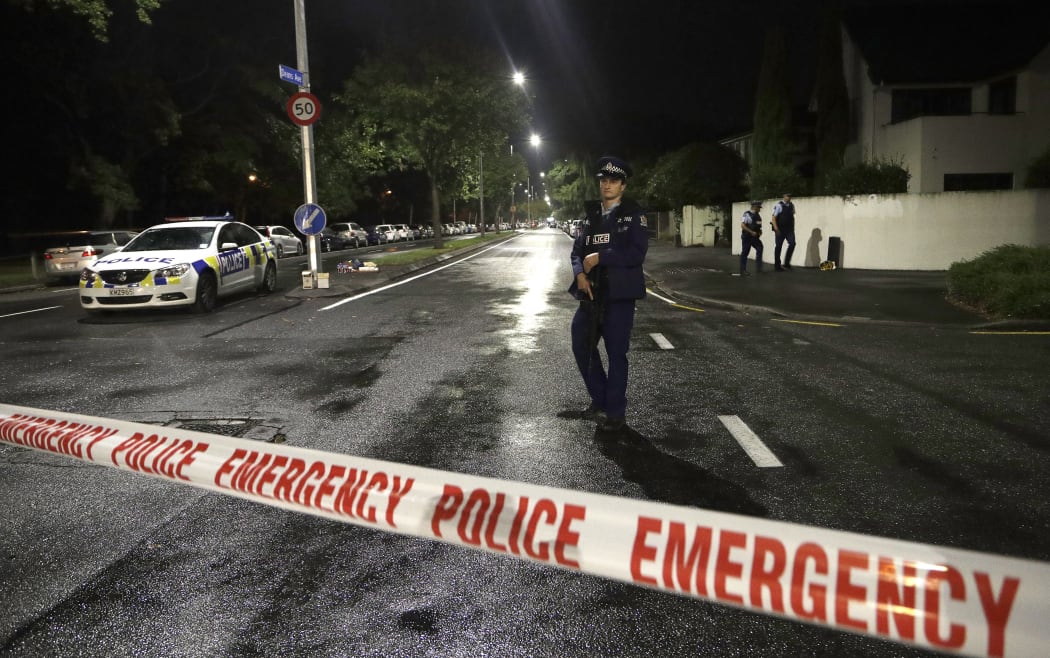 A police officer patrols at a cordon near a mosque in central Christchurch, New Zealand, Friday, March 15, 2019.