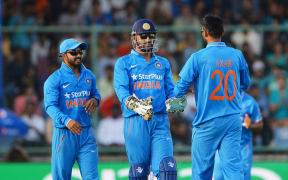 Axar Patel of India (R) celebrates a wicket.