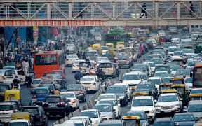Commuters in their vehicles clog the roads of New Delhi.
