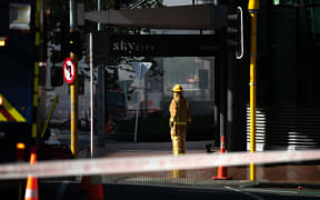 A firefighter outside the Sky City complex on day two of the fire.