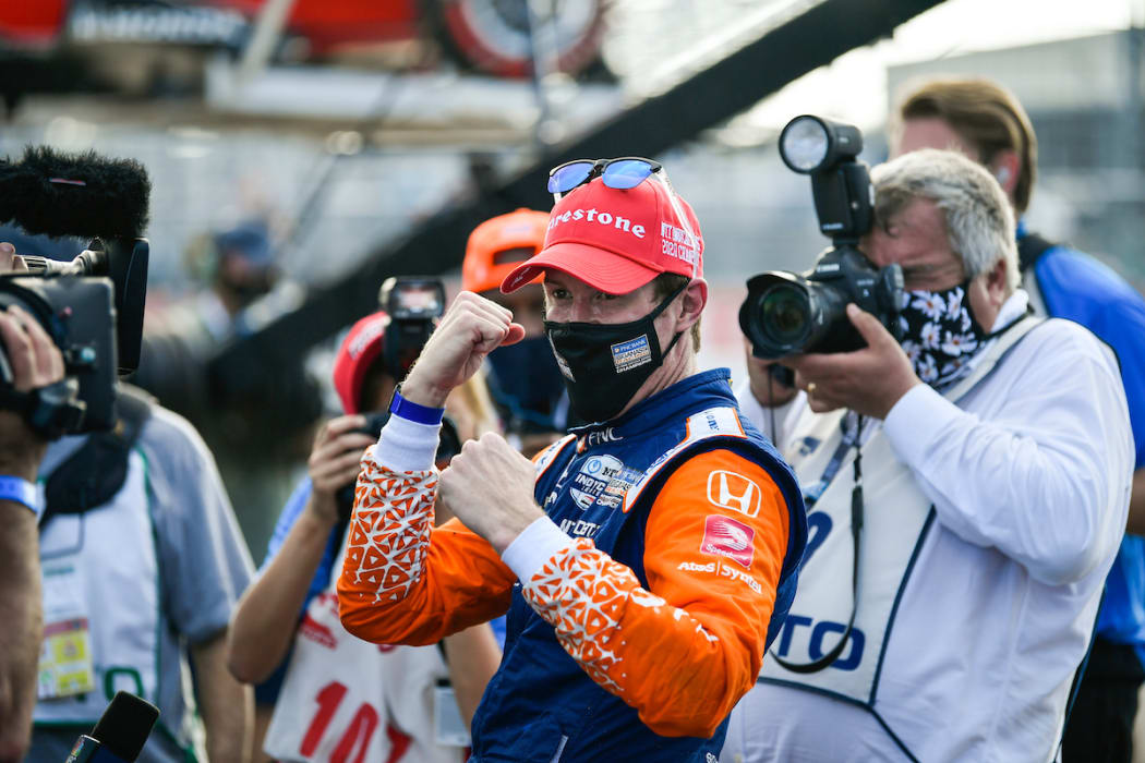 Scott Dixon wearing a mask along with media after his claiming his sixth series crown on 26 October, 2020.