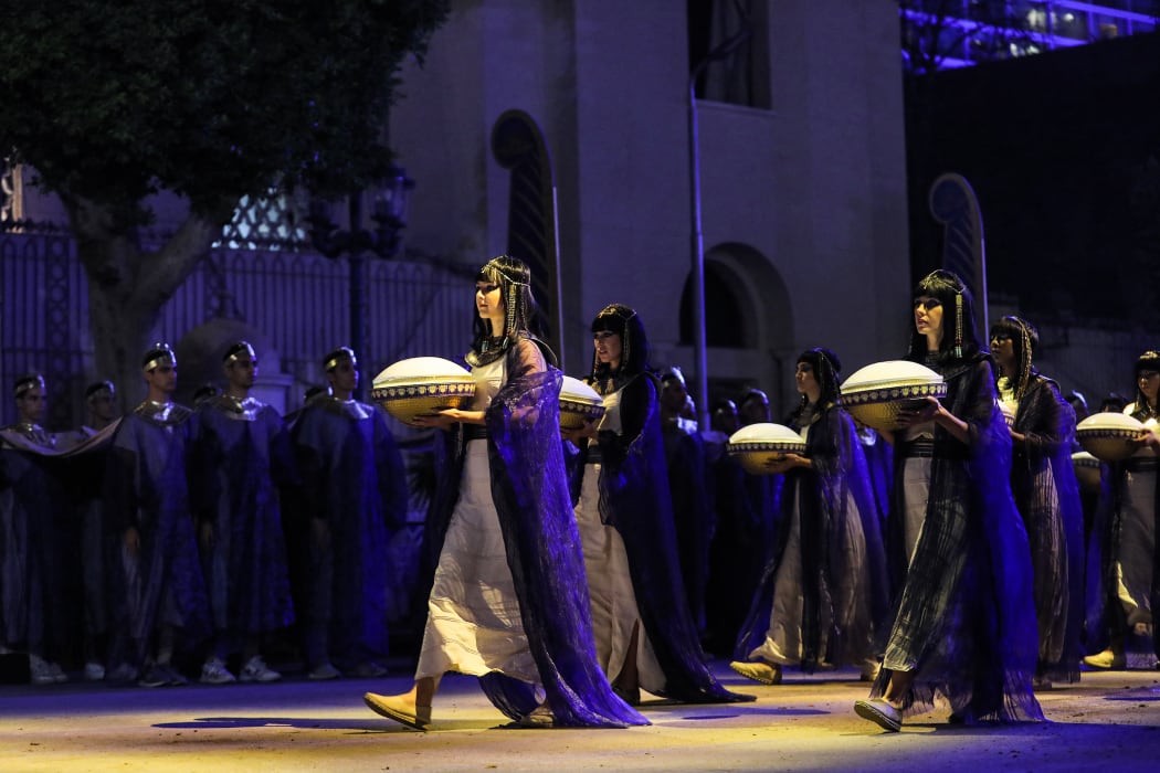 Performers in ancient Egyptian costume march at the start of the parade of 22 ancient Egyptian royal mummies.