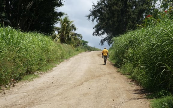 A man walks along a road near Lenakel, on the Vanuatu island of Tanna.