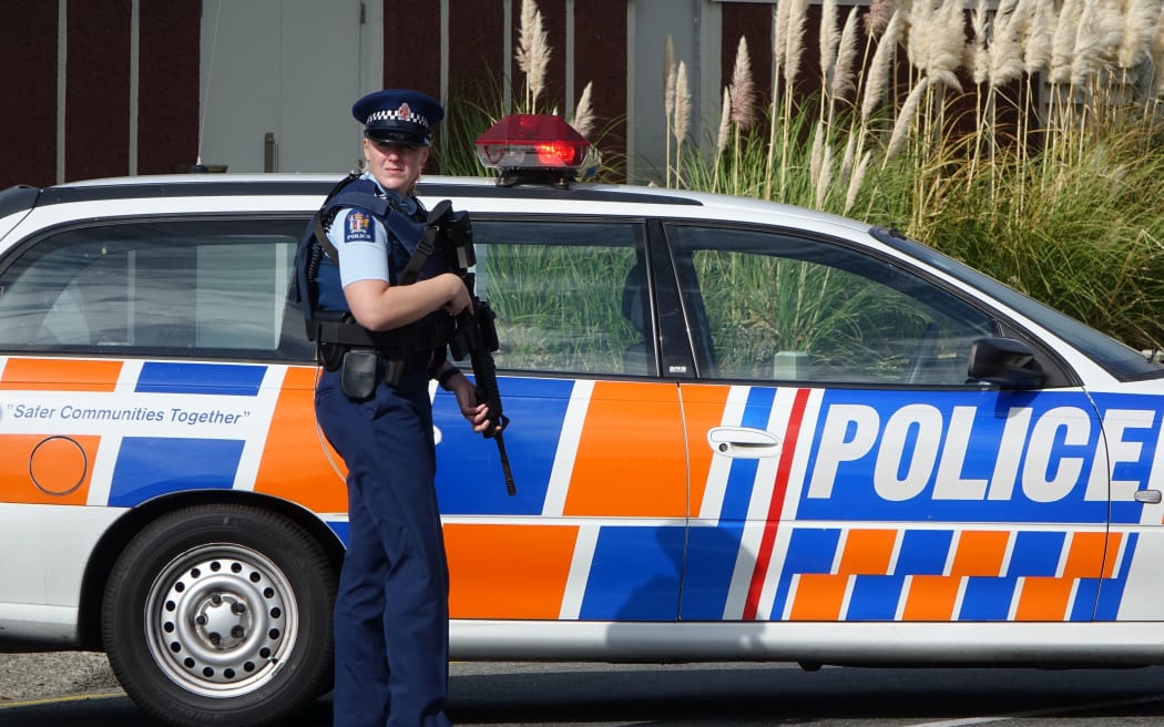 Police have evacuated residents of a Porirua street, north of Wellington, as they hunt for an armed offender who shot dead a police dog.
