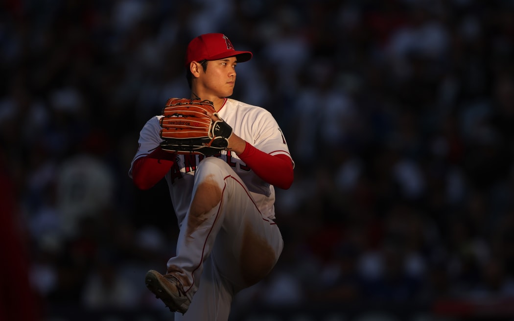 Shohei Ohtani #17 of the Los Angeles Angels pitches during a game against the Los Angeles Dodgers at Angel Stadium of Anaheim.