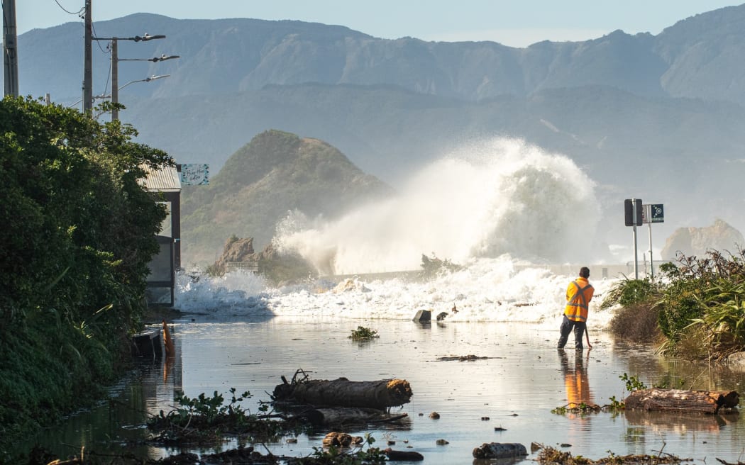 The section of road between Ōwhiro Bay and Island Bay is swamped after massive swells flooded the area.