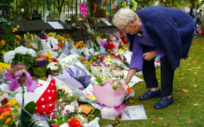 Christchurch residents lay wreaths and condolence cards for those killed at two mosques in the city.