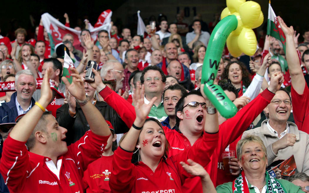 Welsh rugby fans cheer on their side in Cardiff.