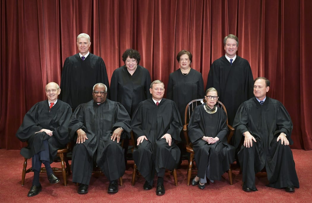 Justices of the US Supreme Court pose for their official photo at the Supreme Court in Washington, DC on November 30, 2018.