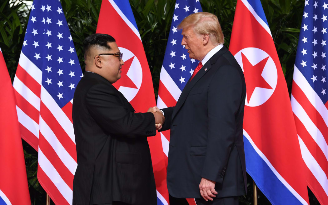 North Korea's leader Kim Jong Un  shakes hands with US President Donald Trump at the start of their historic US-North Korea summit in Singapore in June 2018.