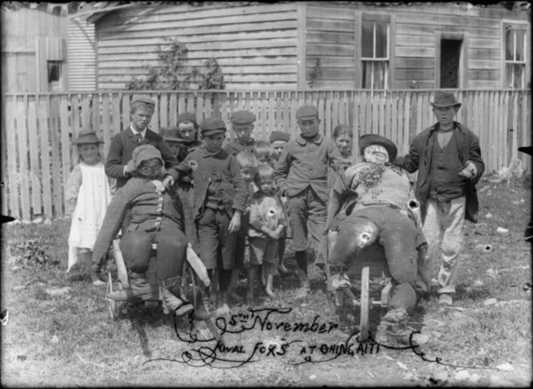 Children with rival guys, Guy Fawkes day at Ohingaiti. c1900