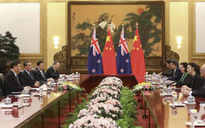 China's President Xi Jinping (left) attends a meeting with Prime Minister Jacinda Ardern at the Great Hall of the People in Beijing.
